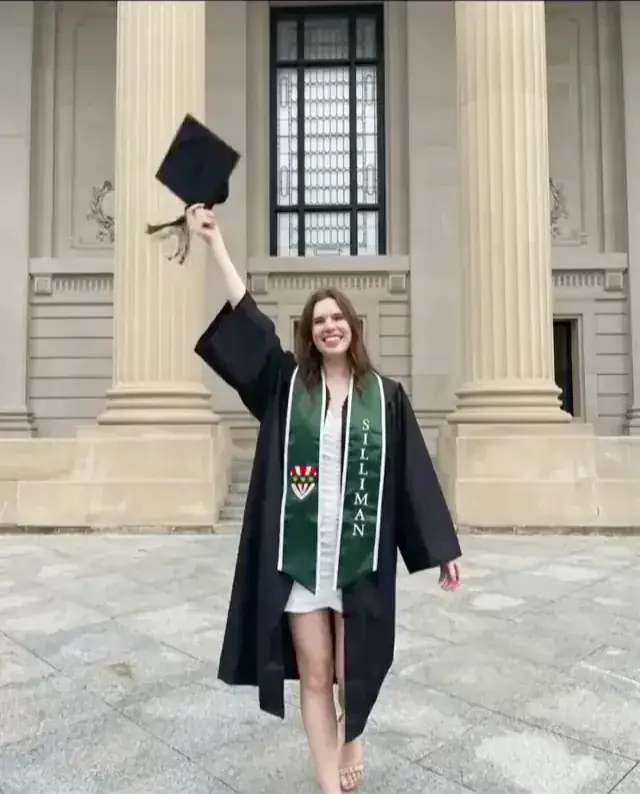 Graduate tossing a cap in celebration